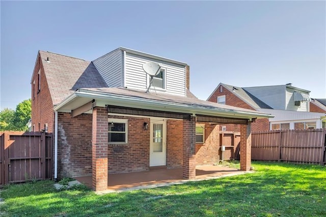 427 Cedar St, Jeannette, PA 15644 - back of property featuring brick siding and a patio area