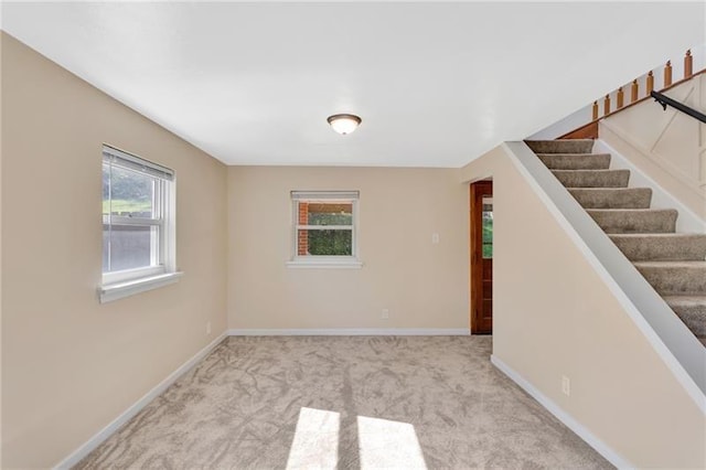 427 Cedar St, Jeannette, PA 15644 - empty room with carpet flooring, baseboards, and stairs