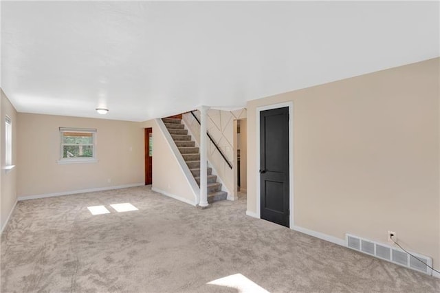 427 Cedar St, Jeannette, PA 15644 - carpeted spare room with stairway and baseboards
