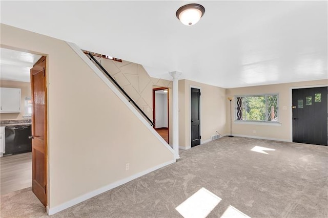 427 Cedar St, Jeannette, PA 15644 - unfurnished living room featuring stairs, light colored carpet, and baseboards