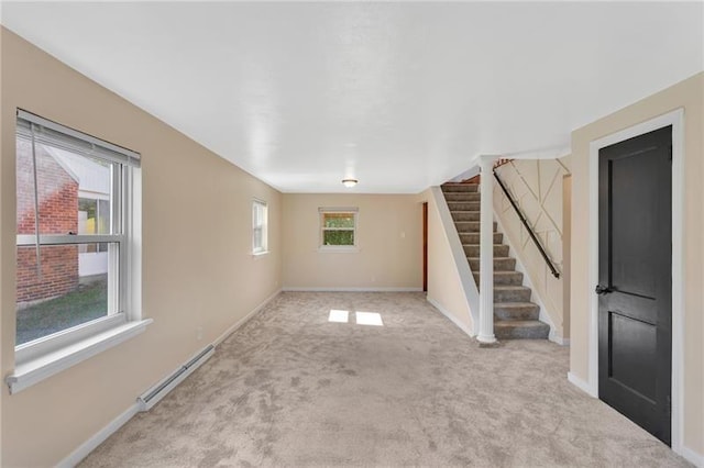 427 Cedar St, Jeannette, PA 15644 - unfurnished living room featuring stairway, plenty of natural light, carpet, and baseboards
