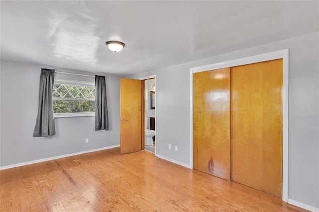 427 Cedar St, Jeannette, PA 15644 - unfurnished bedroom with wood finished floors and baseboards
