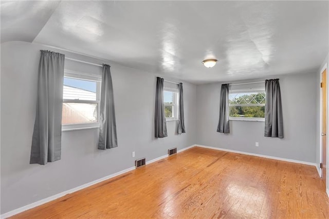 427 Cedar St, Jeannette, PA 15644 - spare room featuring wood finished floors and baseboards