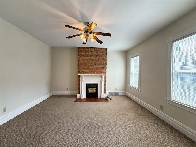 610 Southern Ave, Mt Washington, PA 15211 - unfurnished living room featuring a ceiling fan, a fireplace with flush hearth, carpet floors, and baseboards
