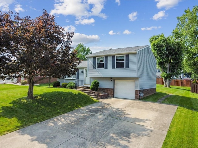 211 Old Meadow Dr, Hempfield Twp Wml, PA 15601 - view of front of house featuring concrete driveway, brick siding, and a garage