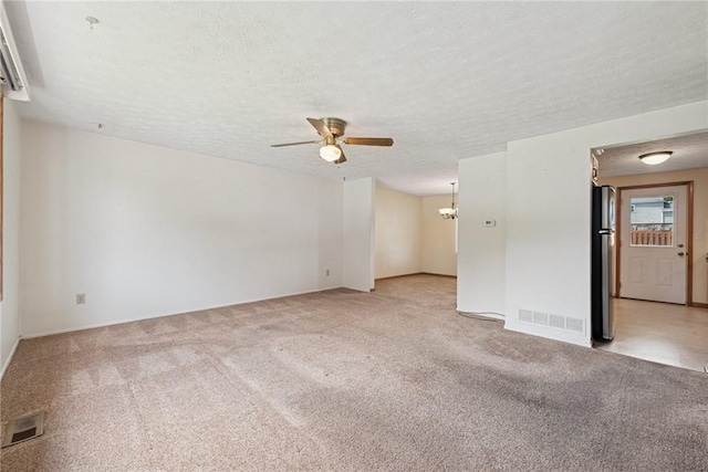 211 Old Meadow Dr, Hempfield Twp Wml, PA 15601 - carpeted empty room with a ceiling fan, a chandelier, a textured ceiling, and baseboards