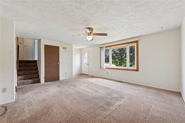 211 Old Meadow Dr, Hempfield Twp Wml, PA 15601 - spare room featuring ceiling fan, carpet floors, a textured ceiling, and baseboards