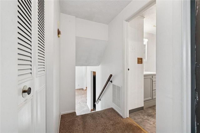 211 Old Meadow Dr, Hempfield Twp Wml, PA 15601 - hallway featuring an upstairs landing, baseboards, carpet flooring, and a textured ceiling