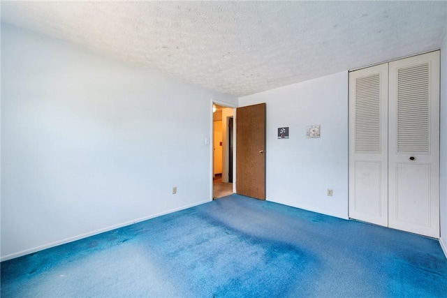 211 Old Meadow Dr, Hempfield Twp Wml, PA 15601 - unfurnished bedroom with a textured ceiling, carpet floors, a closet, and baseboards