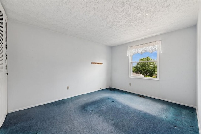 211 Old Meadow Dr, Hempfield Twp Wml, PA 15601 - empty room with carpet floors, baseboards, and a textured ceiling
