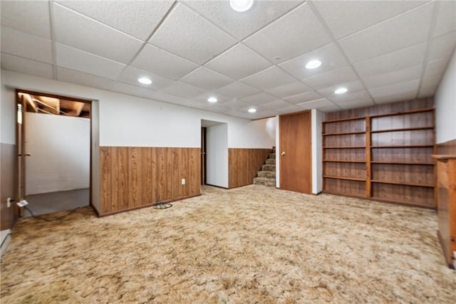 211 Old Meadow Dr, Hempfield Twp Wml, PA 15601 - finished basement featuring carpet flooring, a wainscoted wall, stairway, a paneled ceiling, and wood walls