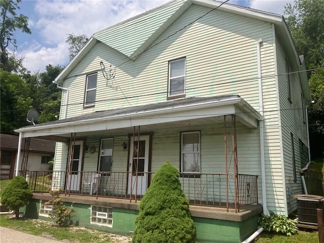76 Laurel Rd, Fallowfield, PA 15022 - view of front facade featuring covered porch and cooling unit