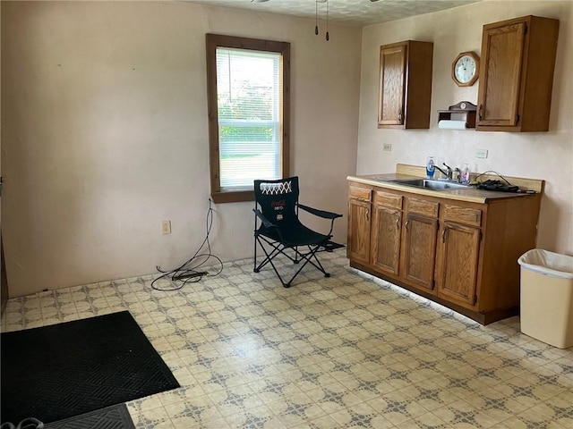 76 Laurel Rd, Fallowfield, PA 15022 - kitchen with a sink, light floors, a ceiling fan, brown cabinets, and light countertops