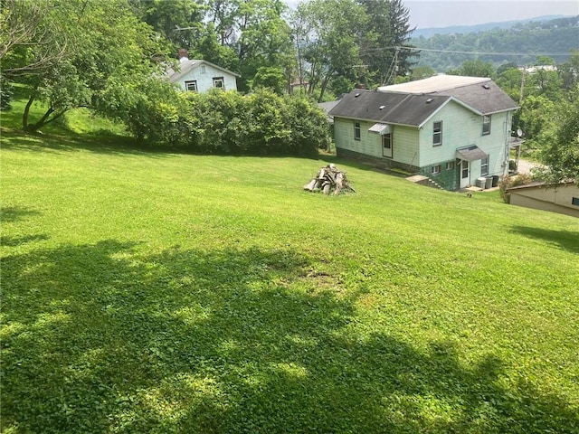 76 Laurel Rd, Fallowfield, PA 15022 - view of green lawn with view of wooded area