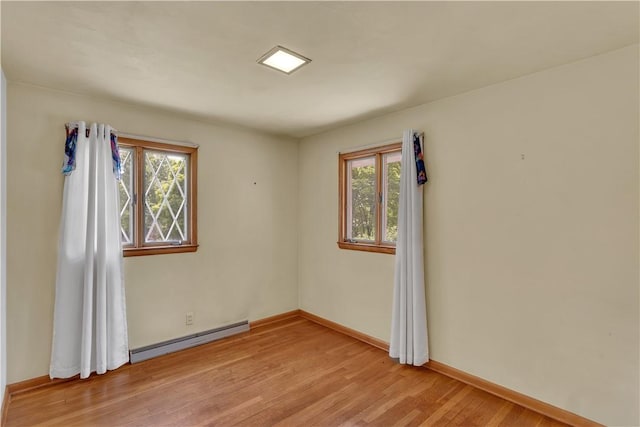 17 Lakeview Dr, Lackawannock Twp, PA 16159 - spare room featuring a baseboard radiator, healthy amount of natural light, light wood-style floors, and baseboards