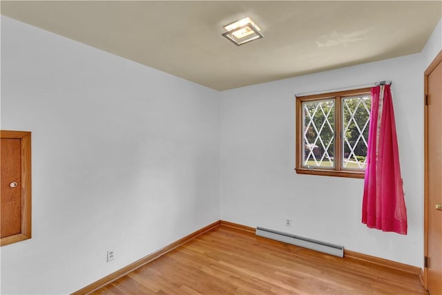 17 Lakeview Dr, Lackawannock Twp, PA 16159 - empty room with a baseboard heating unit, light wood-style floors, and baseboards