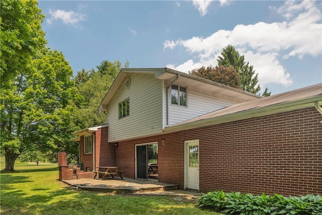 17 Lakeview Dr, Lackawannock Twp, PA 16159 - rear view of house featuring a yard, a patio, and brick siding
