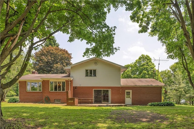 17 Lakeview Dr, Lackawannock Twp, PA 16159 - rear view of house featuring brick siding, a yard, and a chimney