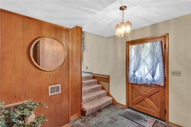 17 Lakeview Dr, Lackawannock Twp, PA 16159 - entryway with baseboards, a chandelier, stairs, and stone finish flooring