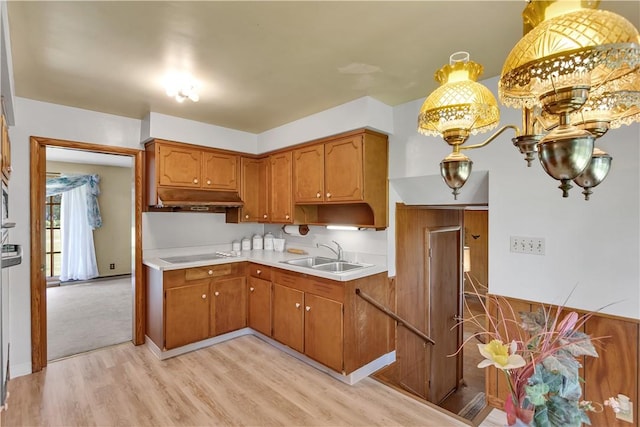 17 Lakeview Dr, Lackawannock Twp, PA 16159 - kitchen featuring a sink, light wood-style flooring, under cabinet range hood, electric cooktop, and light countertops