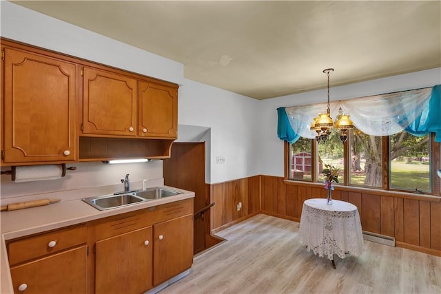17 Lakeview Dr, Lackawannock Twp, PA 16159 - kitchen featuring a sink, baseboard heating, a chandelier, light wood-style floors, and plenty of natural light