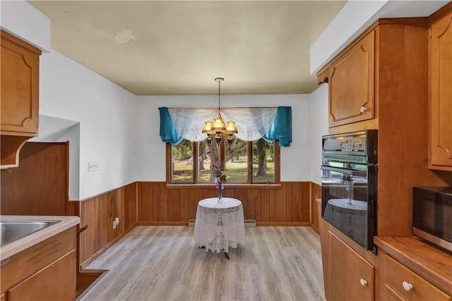 17 Lakeview Dr, Lackawannock Twp, PA 16159 - dining room with a wainscoted wall, a chandelier, light wood finished floors, and wood walls