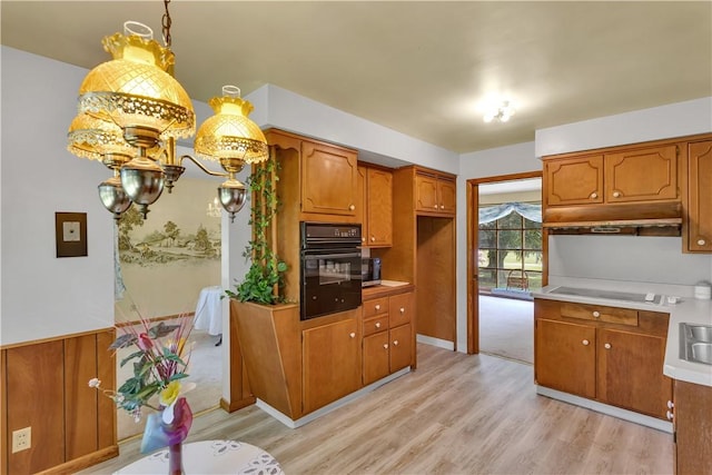 17 Lakeview Dr, Lackawannock Twp, PA 16159 - kitchen with black appliances, brown cabinets, light wood-style flooring, and light countertops