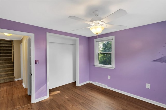 341 State Route 356, Washington Twp Wml, PA 15613 - unfurnished bedroom featuring a closet, wood finished floors, baseboards, and ceiling fan
