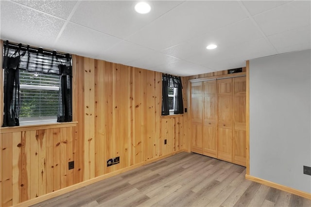 341 State Route 356, Washington Twp Wml, PA 15613 - unfurnished bedroom with wood finished floors, wooden walls, a closet, baseboards, and recessed lighting