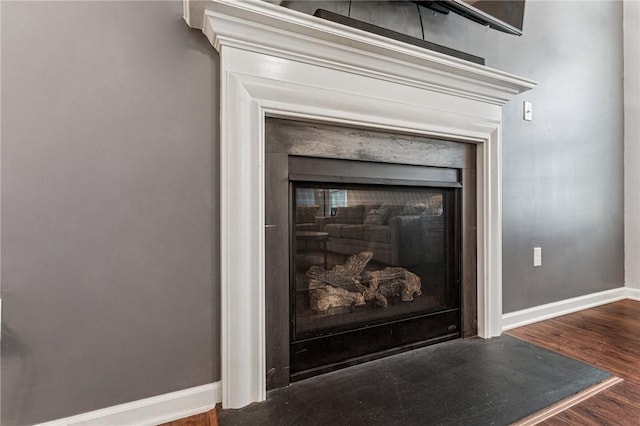 4054 Bentwood Dr, North Strabane, PA 15317 - detailed view of a fireplace, baseboards, and wood finished floors
