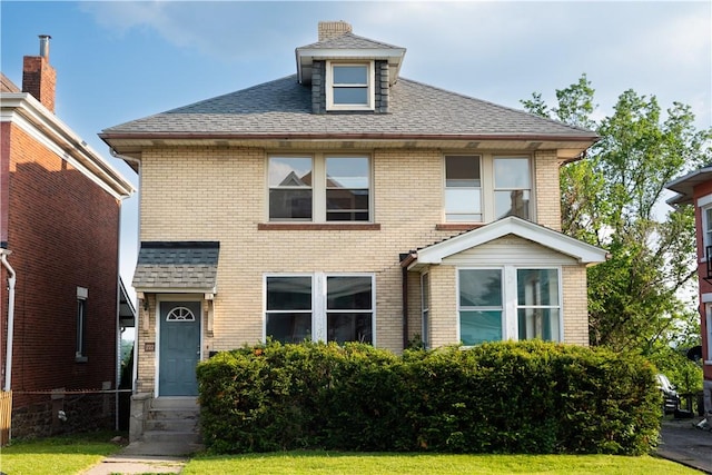 222-224 Alice St, Mount Oliver, PA 15210 - american foursquare style home with brick siding, entry steps, roof with shingles, and a front lawn