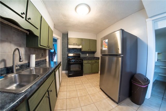 222-224 Alice St, Mount Oliver, PA 15210 - kitchen with freestanding refrigerator, gas stove, green cabinets, under cabinet range hood, and a sink