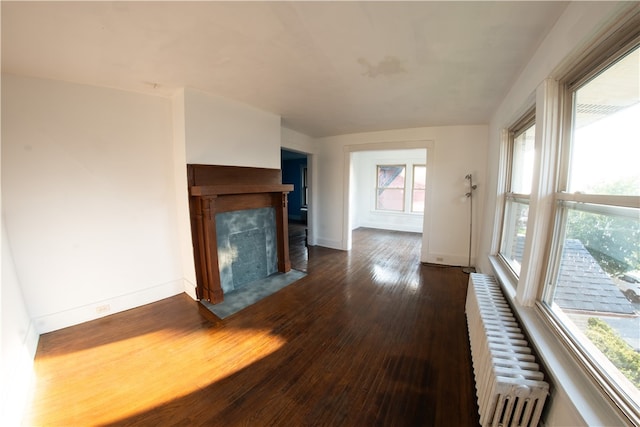 222-224 Alice St, Mount Oliver, PA 15210 - unfurnished living room with radiator heating unit, dark wood-style flooring, a fireplace with flush hearth, and baseboards