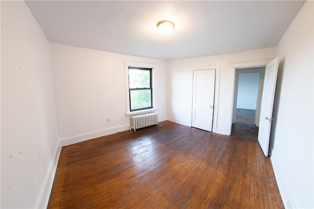 222-224 Alice St, Mount Oliver, PA 15210 - unfurnished bedroom with radiator heating unit, baseboards, dark wood-style floors, and a closet