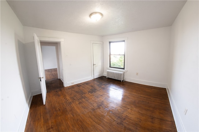 222-224 Alice St, Mount Oliver, PA 15210 - unfurnished bedroom featuring radiator heating unit, wood finished floors, baseboards, and a closet