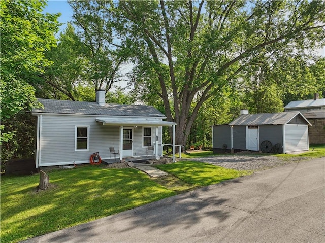 3009 33rd St, Pulaski Twp Bea, PA 15066 - view of front facade with covered porch, a front yard, and a chimney