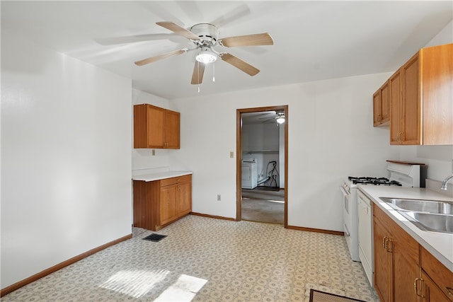 3009 33rd St, Pulaski Twp Bea, PA 15066 - kitchen with brown cabinets, a sink, baseboards, ceiling fan, and light countertops