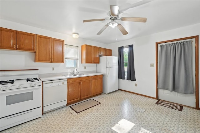 3009 33rd St, Pulaski Twp Bea, PA 15066 - kitchen featuring white appliances, a sink, light countertops, brown cabinets, and ceiling fan
