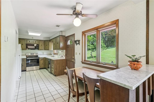190 Pineview Dr, Pine Twp Nal, PA 15090 - kitchen featuring appliances with stainless steel finishes, a sink, light tile patterned floors, and ceiling fan