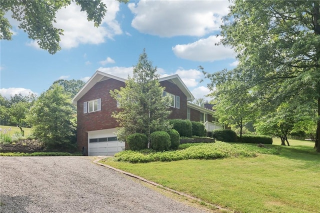 190 Pineview Dr, Pine Twp Nal, PA 15090 - view of home's exterior featuring an attached garage, driveway, brick siding, and a lawn