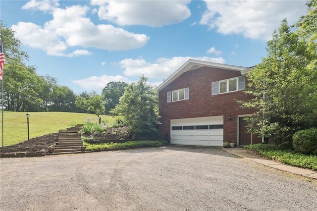 190 Pineview Dr, Pine Twp Nal, PA 15090 - view of side of home with driveway, an attached garage, stairway, brick siding, and a lawn