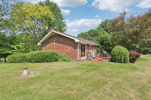 190 Pineview Dr, Pine Twp Nal, PA 15090 - rear view of property featuring brick siding, a patio, a lawn, and a chimney