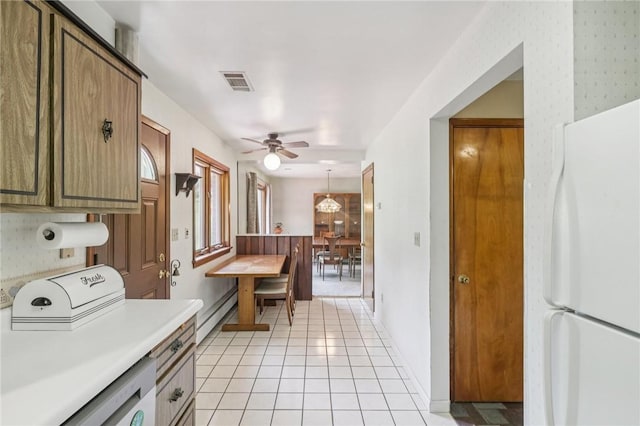 190 Pineview Dr, Pine Twp Nal, PA 15090 - laundry area featuring a ceiling fan, baseboard heating, light tile patterned floors, and baseboards