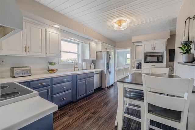 126 Scholl Ln, Rostraver, PA 15012 - kitchen featuring blue cabinets, a sink, stainless steel fridge with ice dispenser, white cabinetry, and black microwave