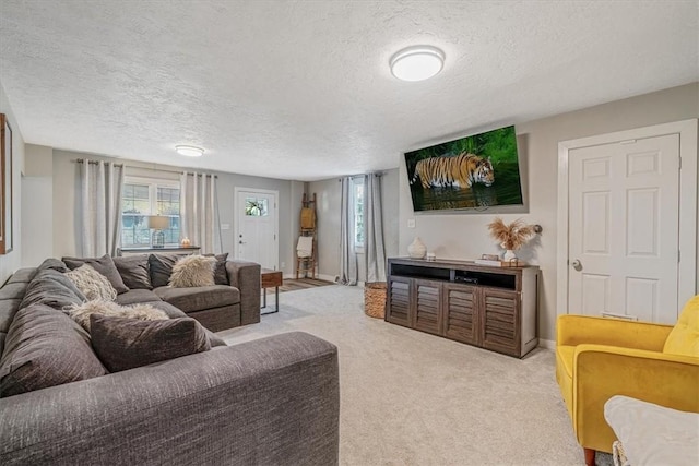 126 Scholl Ln, Rostraver, PA 15012 - living area with a textured ceiling, carpet, and baseboards