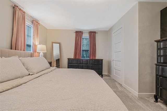 126 Scholl Ln, Rostraver, PA 15012 - bedroom with multiple windows, baseboards, and light carpet