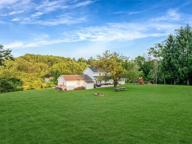 126 Scholl Ln, Rostraver, PA 15012 - view of grassy yard with a playground and a fire pit