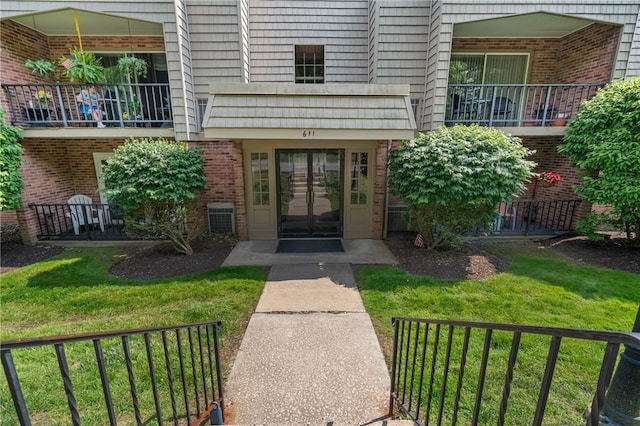 611 N Calais Dr Unit 4212, Mccandless, PA 15237 - doorway to property featuring french doors, brick siding, and a lawn