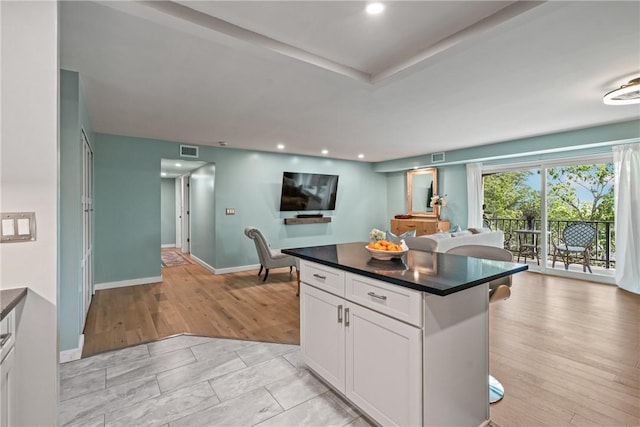 611 N Calais Dr Unit 4212, Mccandless, PA 15237 - kitchen featuring dark countertops, white cabinetry, a breakfast bar, open floor plan, and recessed lighting