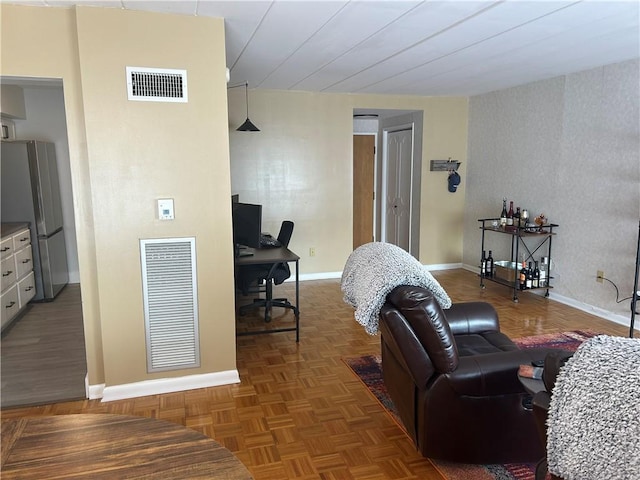 1326 6th Ave Unit 401, Beaver Falls, PA 15010 - living room featuring an office area, baseboards, and wallpapered walls